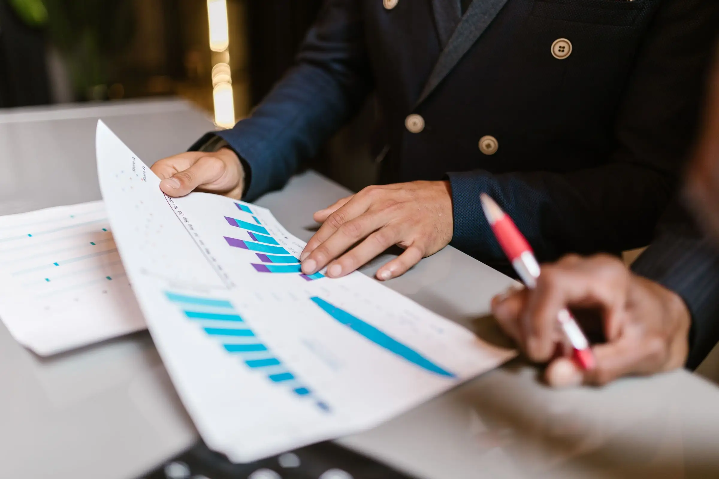 Sales figures reviewed in a meeting